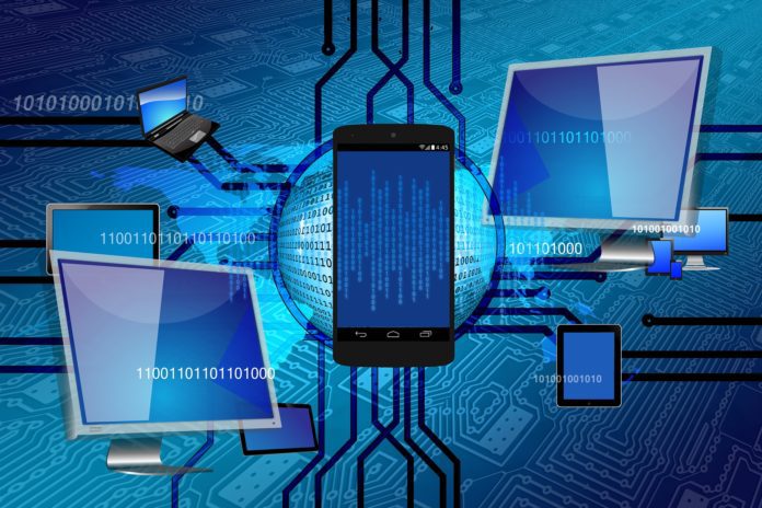 Two monitors, smartphone, and other devices connected via chip wiring overlay