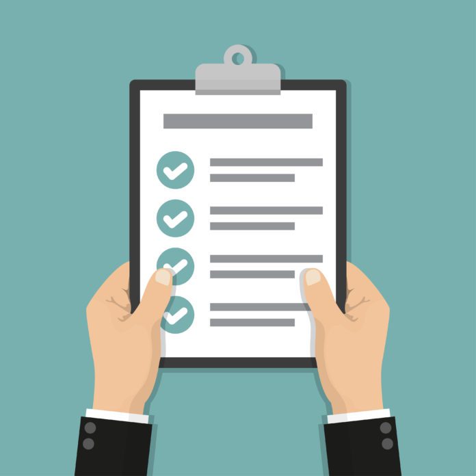 Businessman hands holding clipboard checklist in a flat design