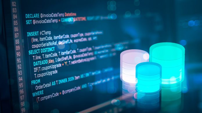 SQL (Structured Query Language) code on computer monitor with Database and server room background. Example of SQL code to query data from a database