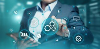 Man managing interconnected systems via a central hub.