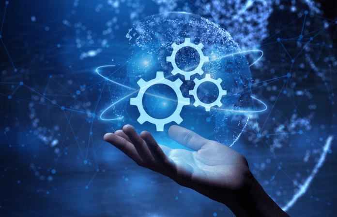 Hand interacting with virtual gears icon on screen with interconnected nodes on the background.