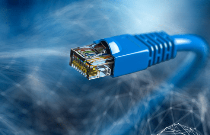 Internet cord RJ45 on blue abstract background.