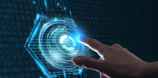 Hand interacting with a virtual update icon embedded on an integrated circuit.