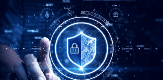 Man accessing a computer device with a protective shield against cyber threats.