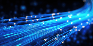 Glowing blue strands of fiber optic cables illustrating digital connectivity.