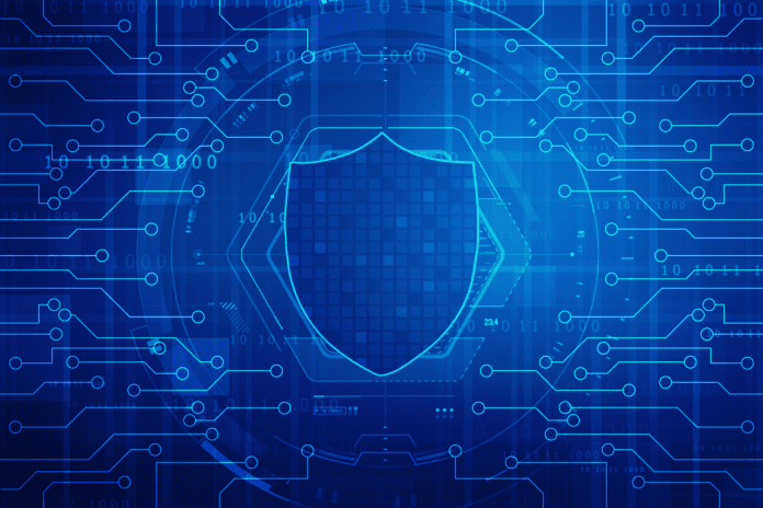 Digital shield surrounded with circuit patterns.