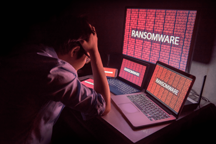 Man in despair after a ransomware attack.